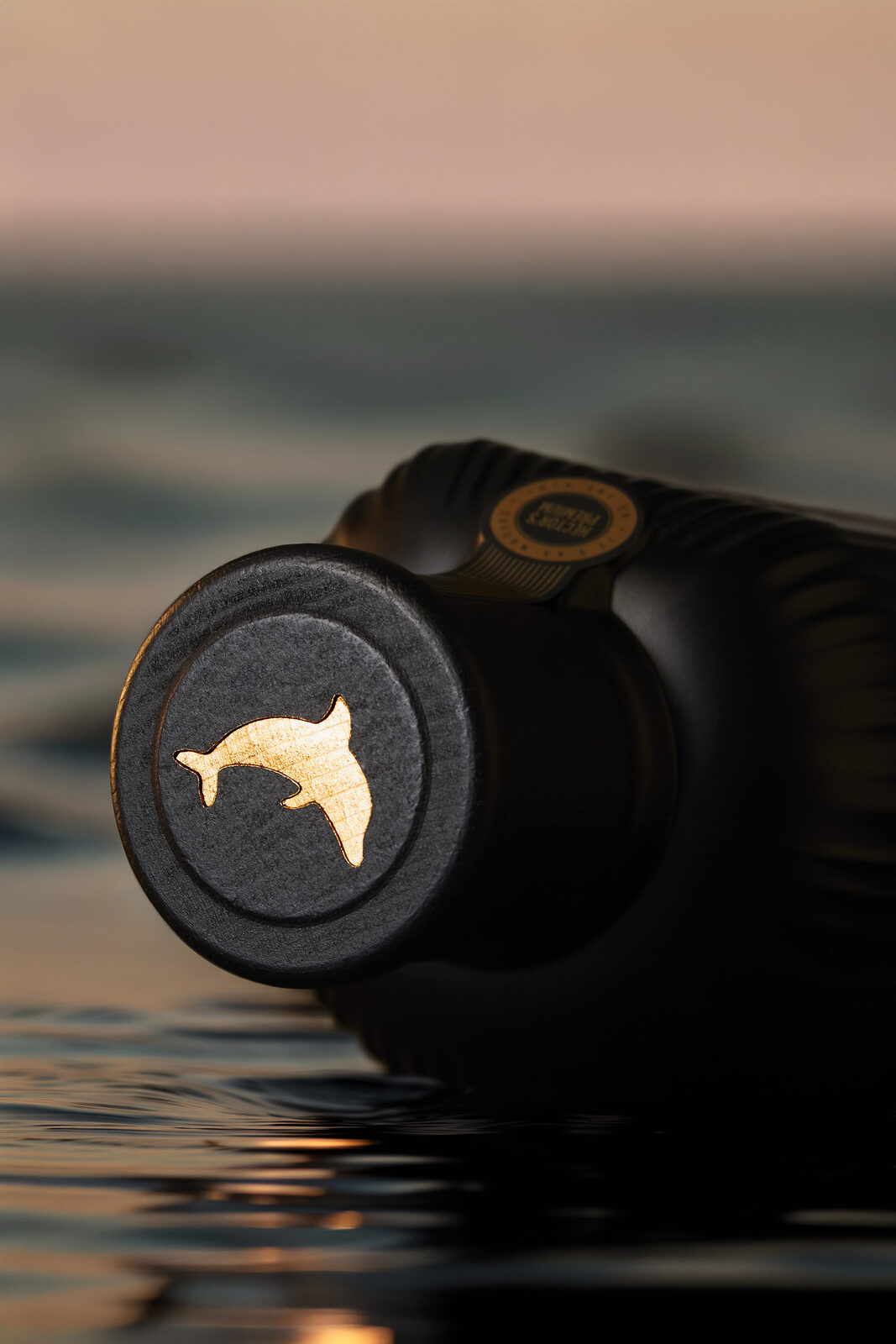 Hector's dolphin embossed into the bottle lid